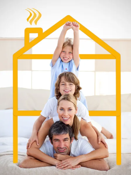 Family having fun with yellow drawing house — Stock Photo, Image