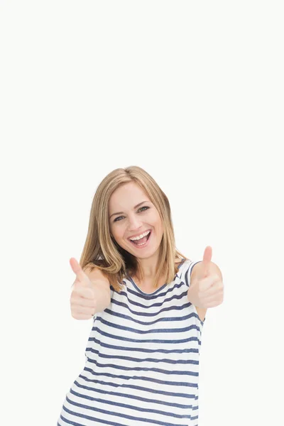 Portrait of cheerful young woman gesturing double thumbs up — Stock Photo, Image