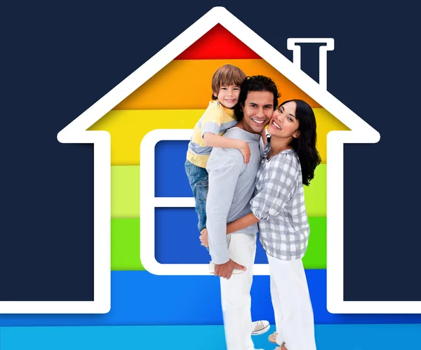 Embracing family standing with a house illustration — Stock Photo, Image