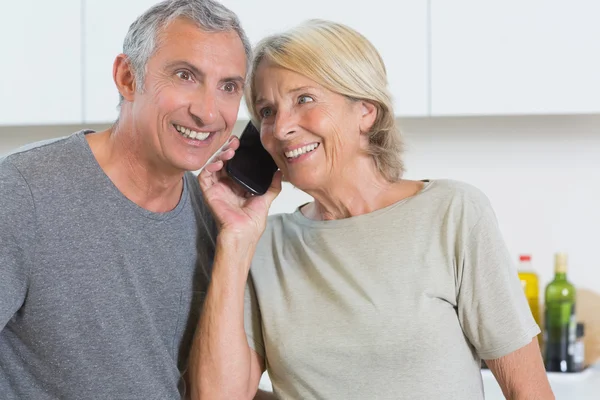 Couple taking a call together — Stock Photo, Image