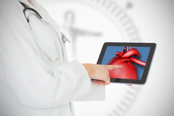 Doctor showing her tablet with red heart — Stock Photo, Image