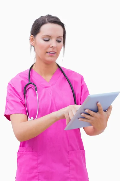 Young nurse using digital tablet — Stock Photo, Image