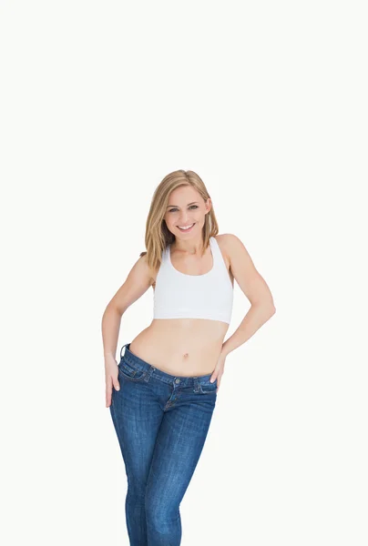 Portrait of happy young in jeans posing — Stock Photo, Image