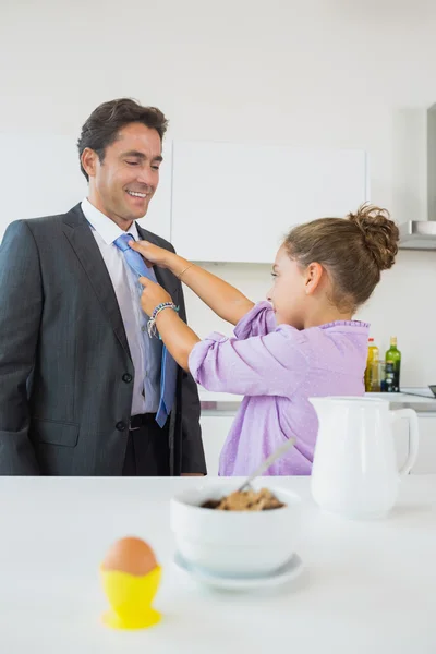 Daughter fixing fathers tie — Stock Photo, Image