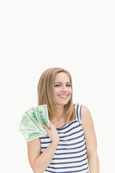 Portrait of happy young woman with fanned dollars — Stock Photo, Image