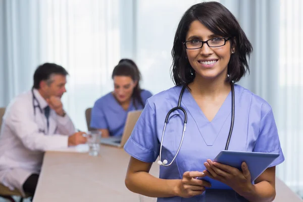 Smiling nurse with tablet pc — Stock Photo, Image