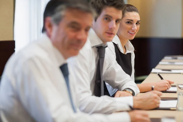 Smiling businesswoman in meeting — Stock Photo, Image