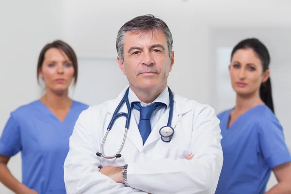 Doctor and his team of nurses — Stock Photo, Image