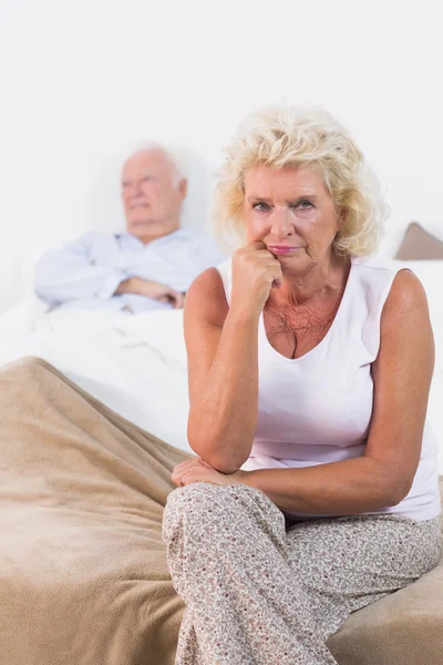 Disappointed old woman sitting — Stock Photo, Image