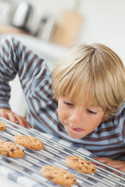 Boy licking his lip — Stock Photo, Image