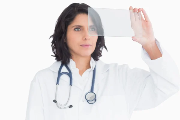 Doctor examining virtual screen — Stock Photo, Image