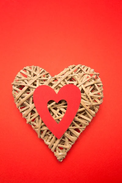 Wicker heart ornament with red cut out — Stock Photo, Image