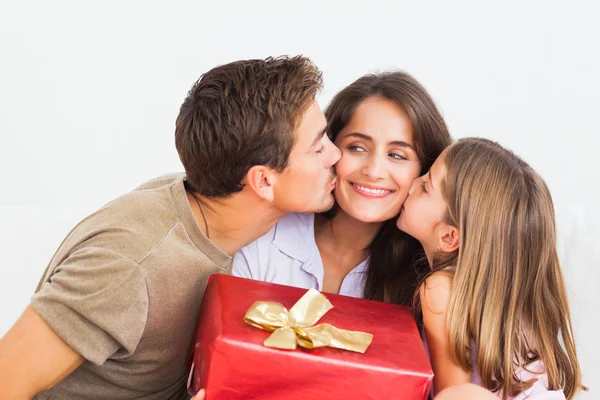 Father and his daughter offering a red gift — Stock Photo, Image