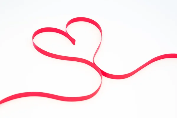 Pink ribbon in heart shape — Stock Photo, Image