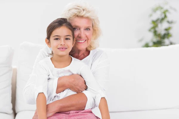 Smiling granddaughter and grandmother portrait — Stock Photo, Image