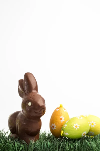 Chocolate bunny rabbit and two easter eggs — Stock Photo, Image