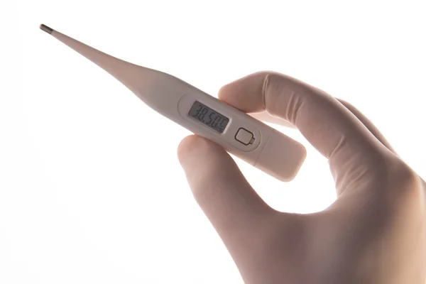Gehandschoende hand met digitale thermometer — Stockfoto
