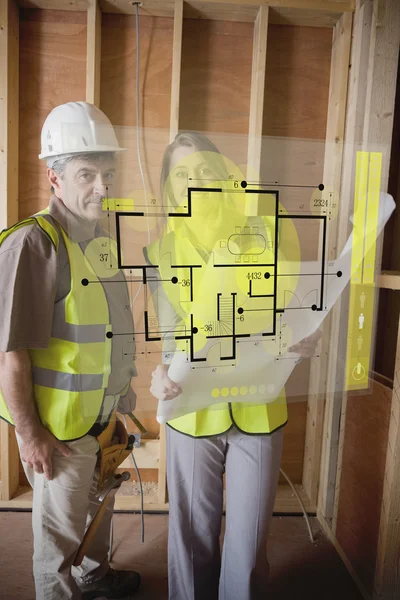 Architect and foreman checking the plans on interface — Stock Photo, Image