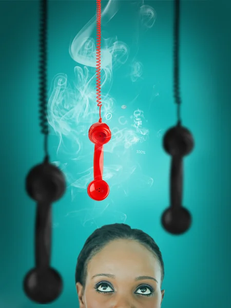 Mujer mirando al receptor de teléfono colgante —  Fotos de Stock