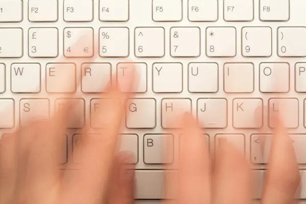 Hand typing on keyboard — Stock Photo, Image