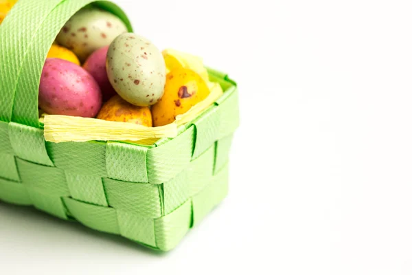 Speckled easter eggs in a basket — Stock Photo, Image