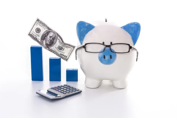 Blue and white piggy bank wearing glasses with blue graph model — Stock Photo, Image