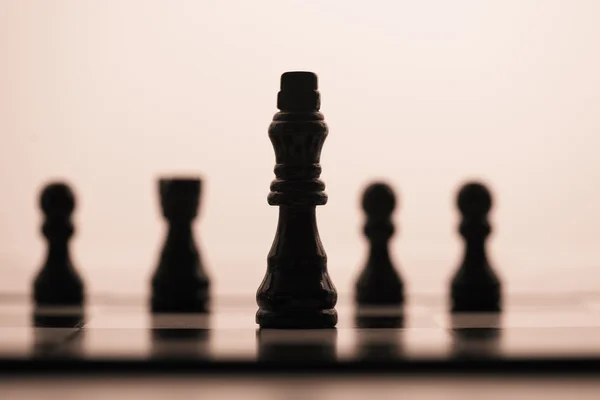 Black chess pieces in a row — Stock Photo, Image