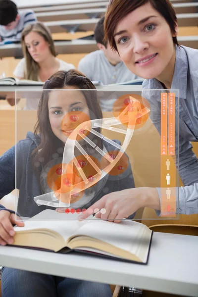 Teacher and student looking futuristic interface with DNA — Stock Photo, Image