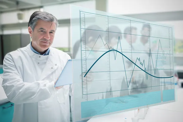 Confident scientist working with tablet and futuristic interface — Stock Photo, Image