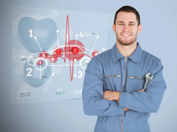 Portrait of a young mechanic next to futuristic interface with d — Stock Photo, Image