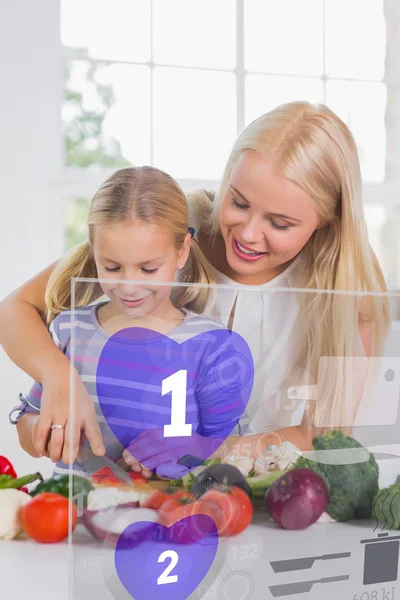 Mother and daughter chopping vegetables with purple holographic — Stock Photo, Image