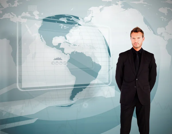 Businessman standing against world map display — Stock Photo, Image