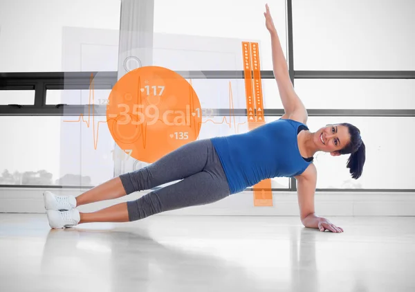 Mujer atractiva haciendo yoga con interfaz futurista junto a él —  Fotos de Stock