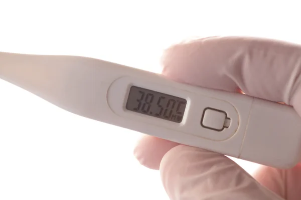 Gloved hand holding thermometer — Stock Photo, Image
