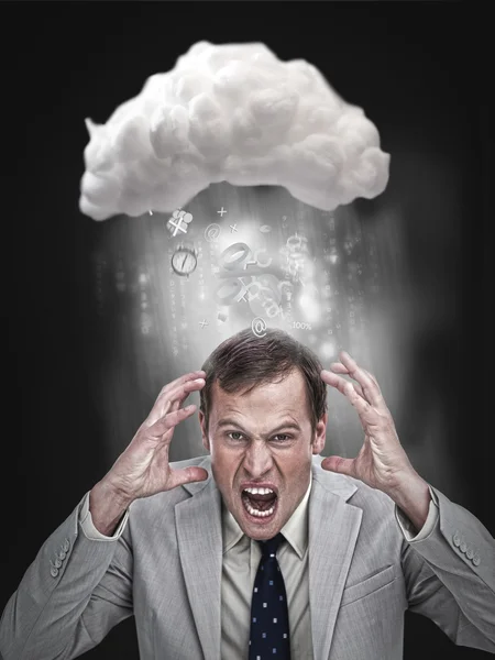 Businessman stressing out under a cloud — Stock Photo, Image