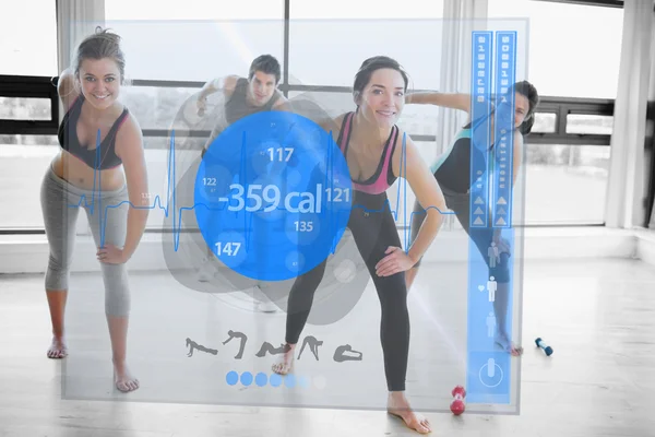 Women doing exercises with trainer while looking futuristic inte — Stock Photo, Image