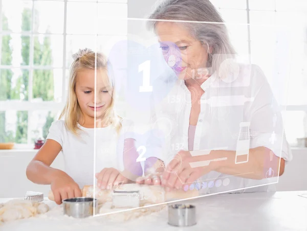 Grandmother and granddaughter baking with white interface — Stock Photo, Image