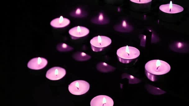 Velas rosadas en alter soplando — Vídeos de Stock