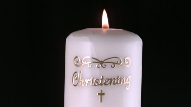 Lit christening candle flickering and going out — Stock Video