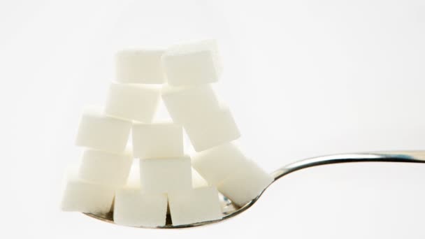 Sugar cubes vanishing from teaspoon — Stock Video