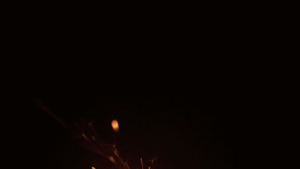 Sparks flying on black background — Stock Video