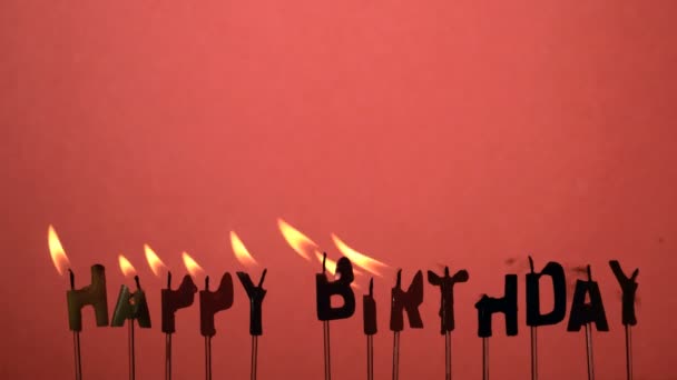 Silhouette of happy birthday candles being extinguished — Stock Video