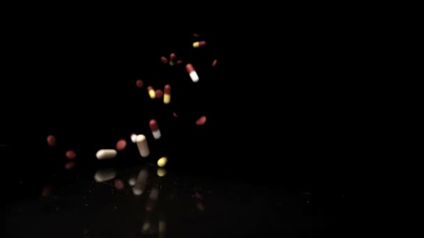 Pills falling and flying towards camera — Stock Video