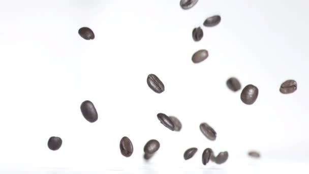 Bouncing coffee beans — Stock Video