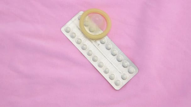 Contraceptive pill packet with condom — Stock Video