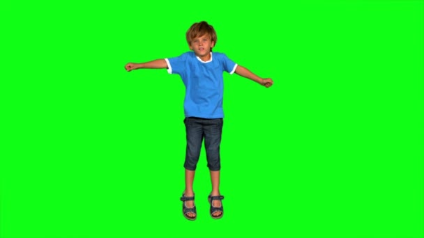 緑色の画面上でジャンプ少年 — ストック動画