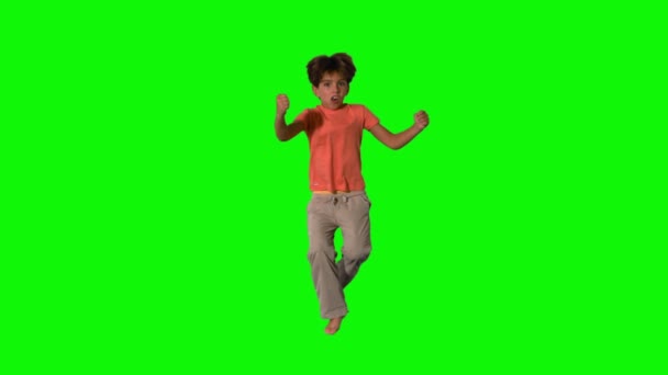 Boy jumping and cheering on green screen — Stock Video