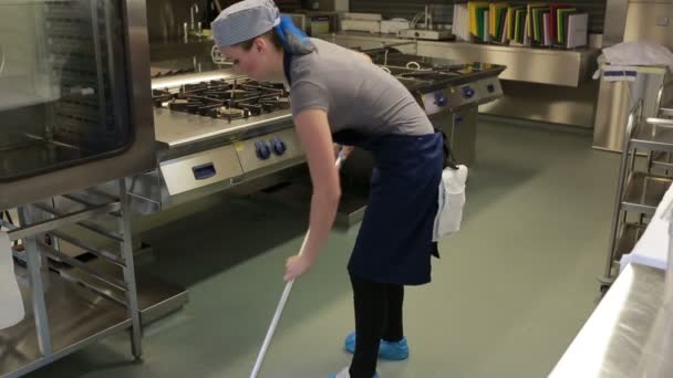 Cleaner of a kitchen wiping the floor — Stock Video