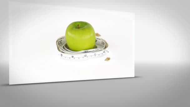 Clip van apple omringd door meetlint — Stockvideo