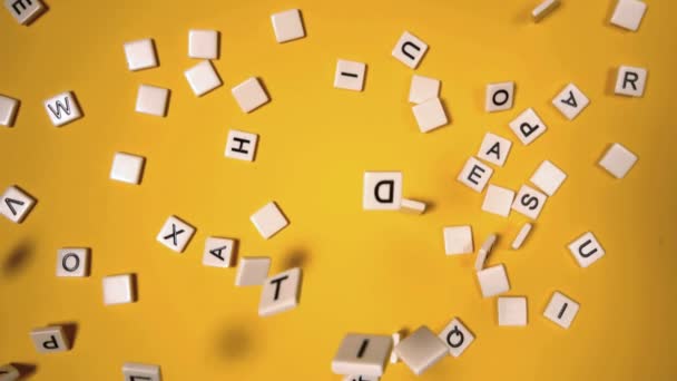 Plastic letters bouncing and spelling out autism — Stock Video